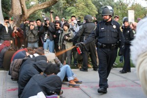 Police pepper-spray seated protesters