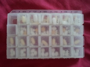 Seven day pill tray full of pills